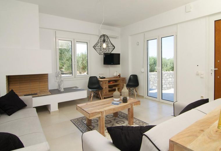 Bright living room of Villa Aada with fireplace and seating