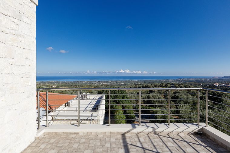 Villa Eos terrace with a panoramic view across the plain to the coast