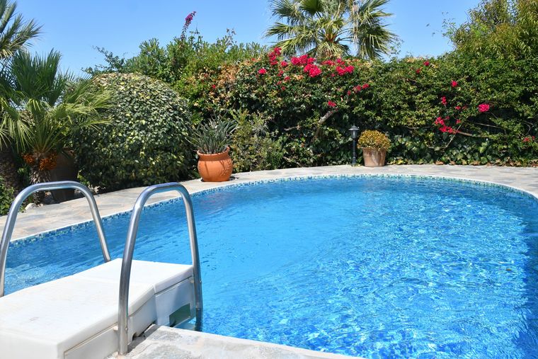 Villa Mailin pool surrounded by bougainvillea